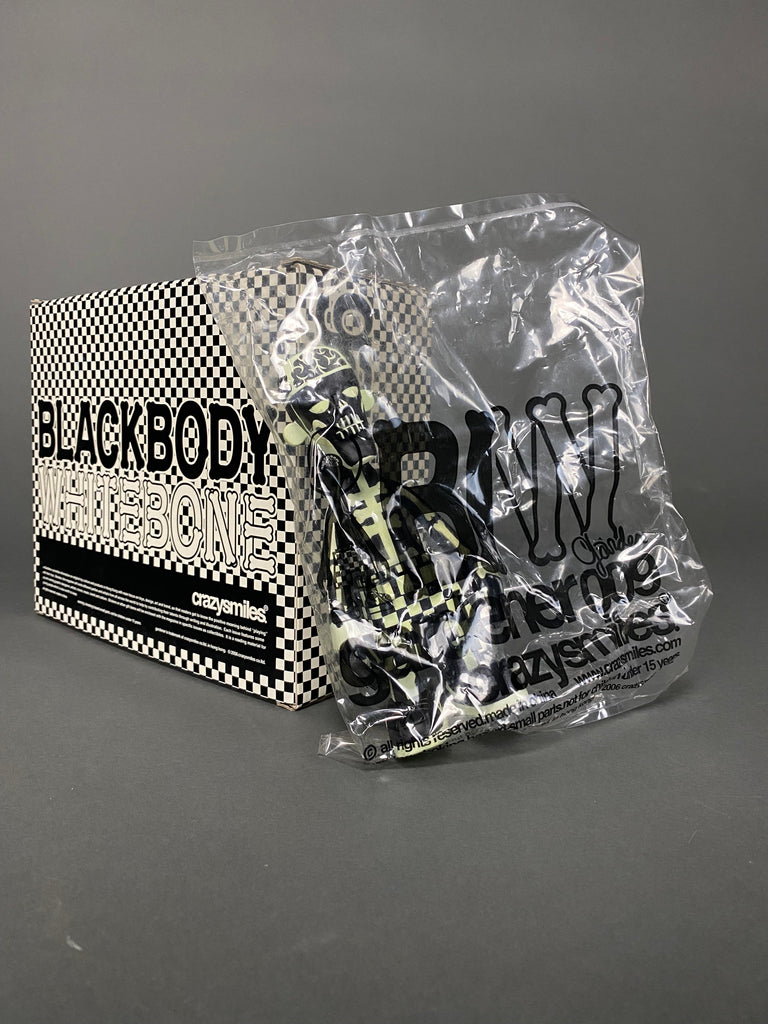 GLOW IN THE DARK BLACK BODY WHITE BONE 2006 DESIGNER TOY BY MICHAEL LAU - Art Toys